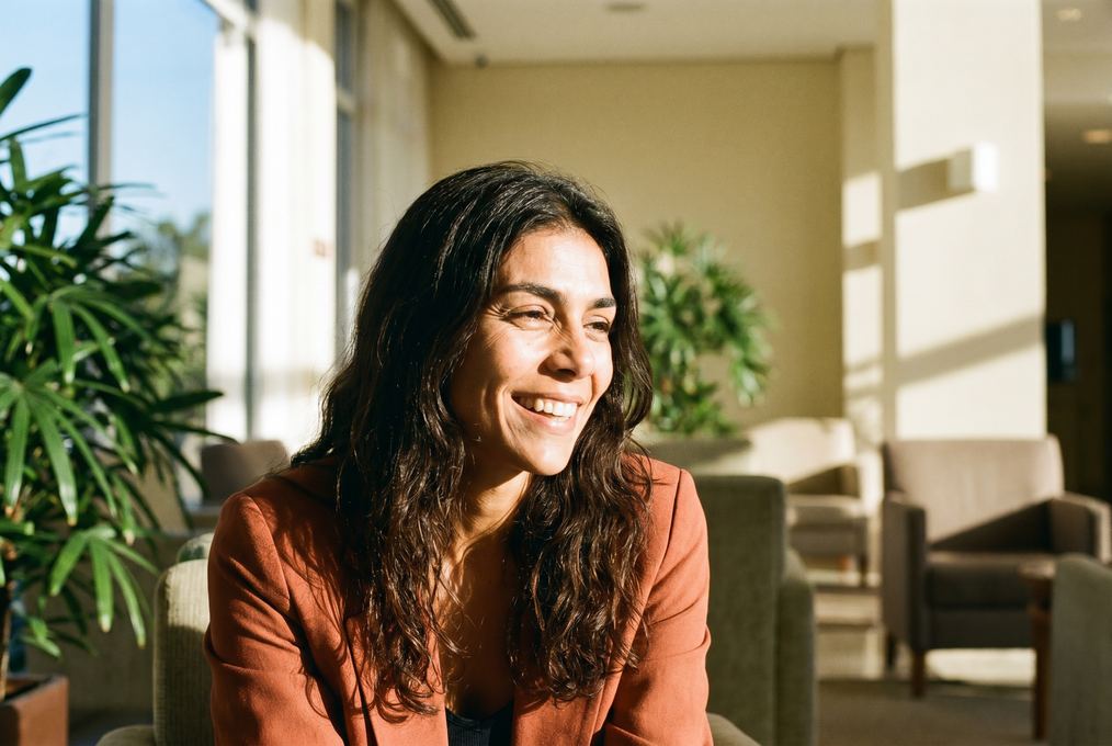 Smiling portrait in a sunlit lobby