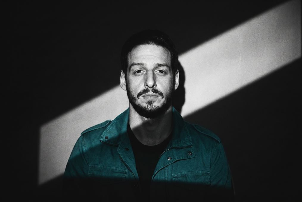 Black and white portrait with a beam of light